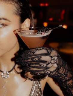 hospitality — cocktail with black lace glove